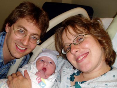 Ian, shortly after birth, with his parents.